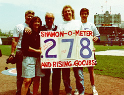 Shawon-O-Meter group on the field at Wrigley Field with Harry Carey